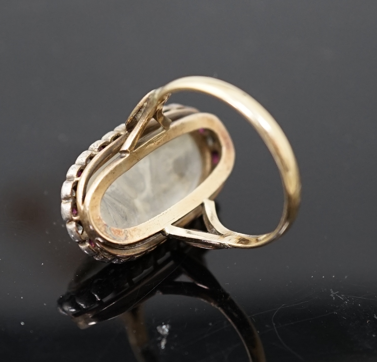 A 1930's continental 14k gold, moonstone?, ruby and diamond cluster set upfinger ring